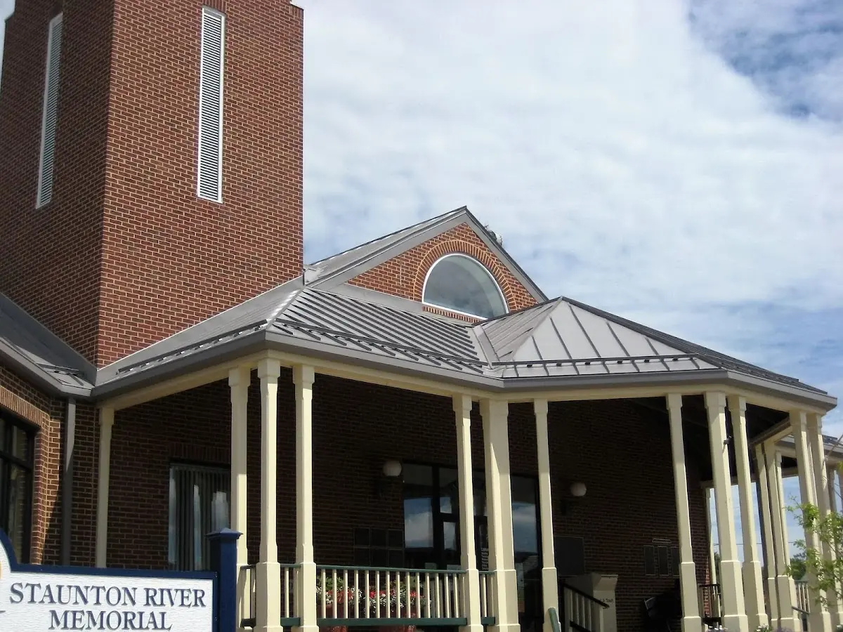Skilled roofing craftsmen working on a residential roof in St. Joseph